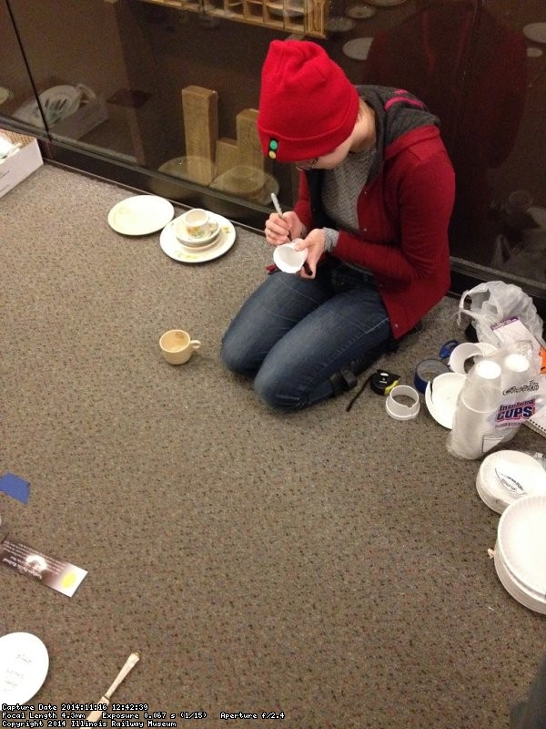 Patrice brought paper plates and cups to make a mock up of the china exhibit - Photo by Michael McCraren