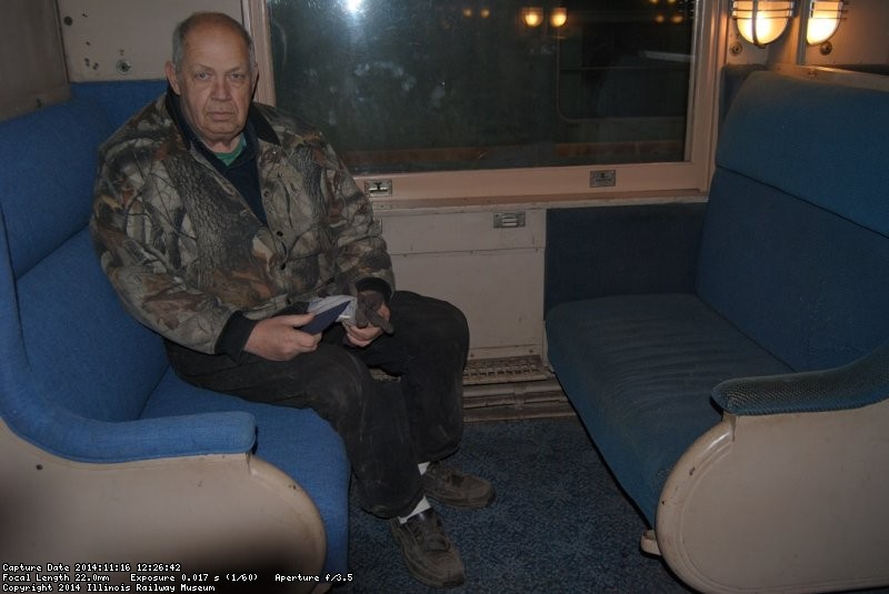 John McKelvey sits on a seat he has recently reupholstered - Photo by Shelly Vanderschaegen