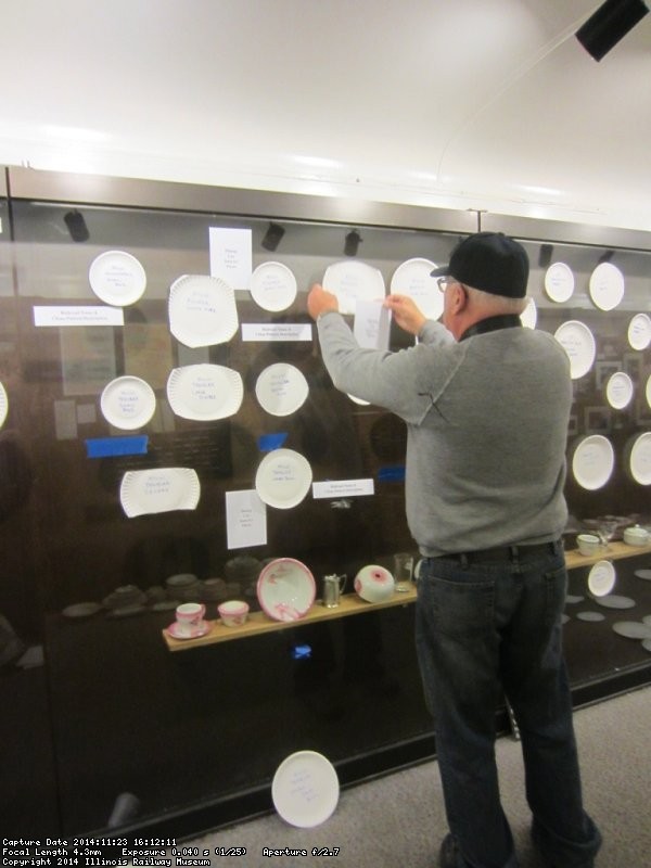 Jim Windmeier arranging the paper plate china - Photo by Patrice Connelly