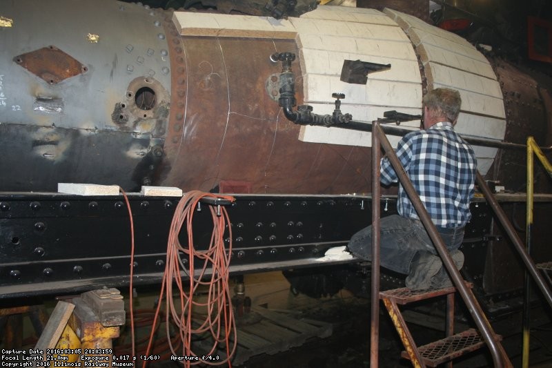 Jerry fits lagging to the boiler