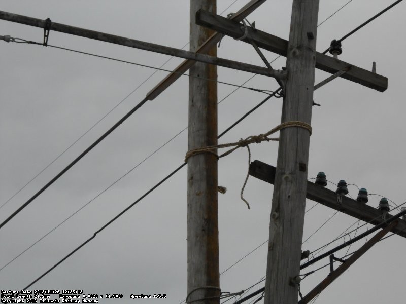 Old broken pole lashed to new pole