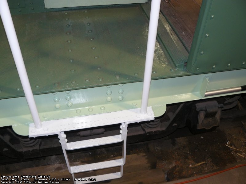 The handrails and steps on the first end were painted white.