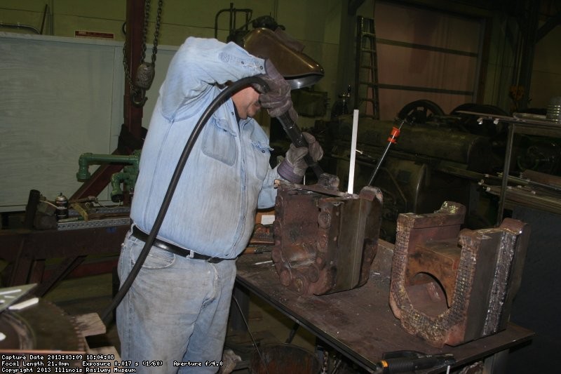 Dennis builds up a truck axle box