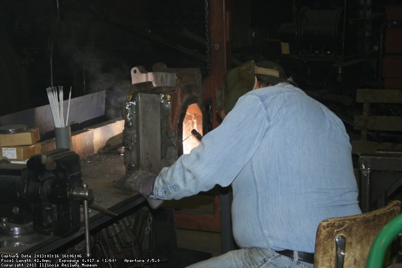 Dennis building up truck axle box