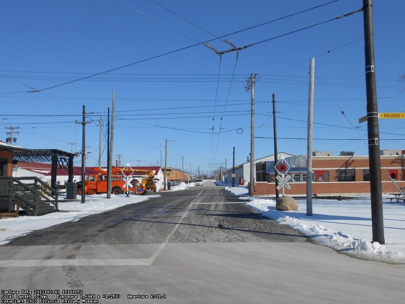 Central Ave. looking East from Railroad Ave.  Double trolley bus wire will begin East of Depot St.  About where the car is parked.