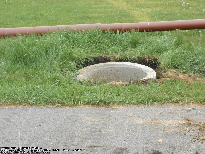 Concrete pipe "bubbled down" below grade.