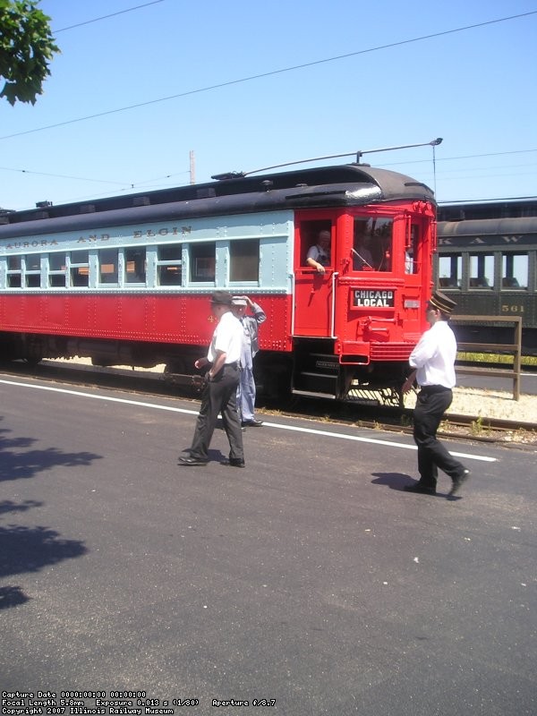 Motorman Randy Hicks (train 308) talks to Motorman Jeff Obarek (train 431) as Frank Hicks and Conductor Jim Pechous (train 431) walk by.