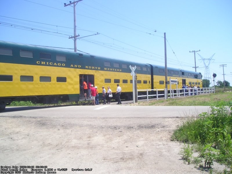 Only a few people left, as the train prepares to depart.