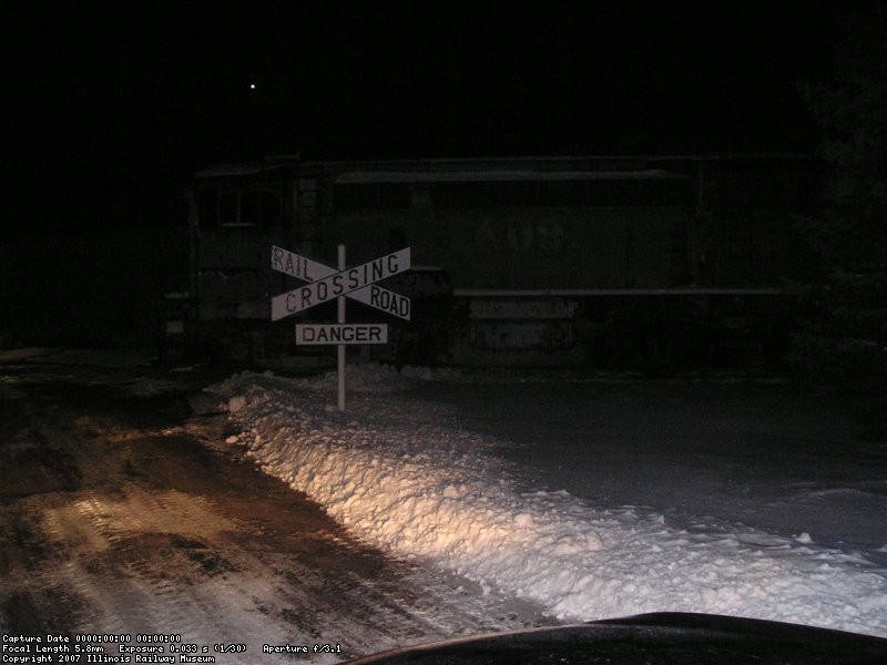 A shot of the 409 in the snow at night.