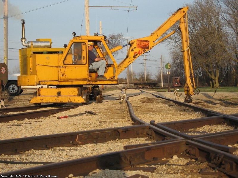 Paul uses the tie crane to remove the dirt, also known as ties