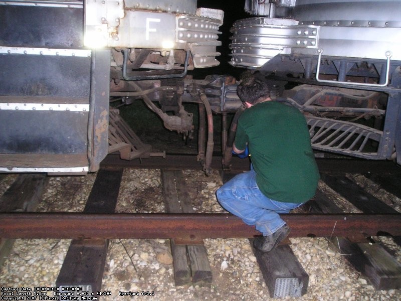 Joe Stupar prepares to put in the control jumper between cars 251 and 757/714 in the pit track.