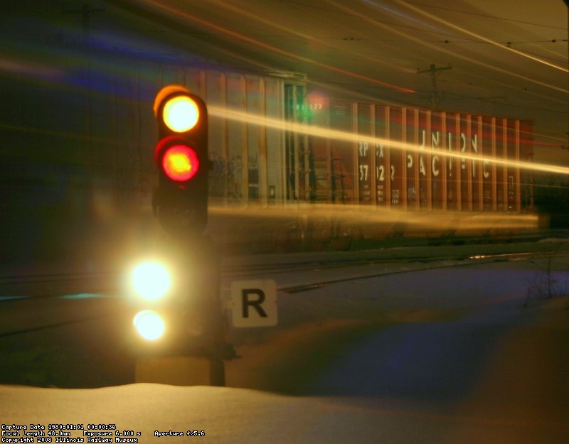 Santa Train passing the signal to Carline Jct. at 8PM Sunday