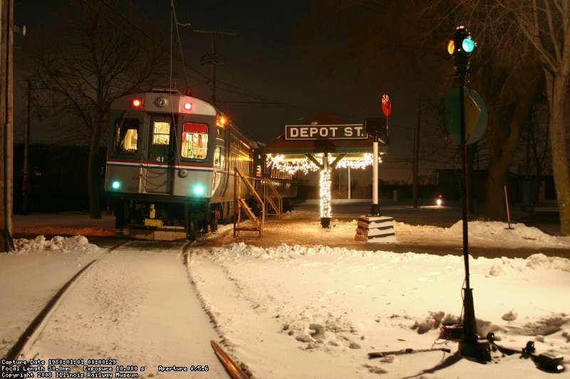 Waiting at Depot St (lit switch lantern)