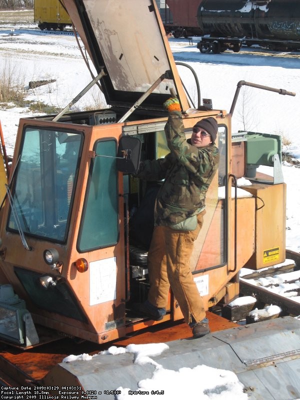 Frank pointing to the snow that will eventually melt off the boom and fall into his lap...