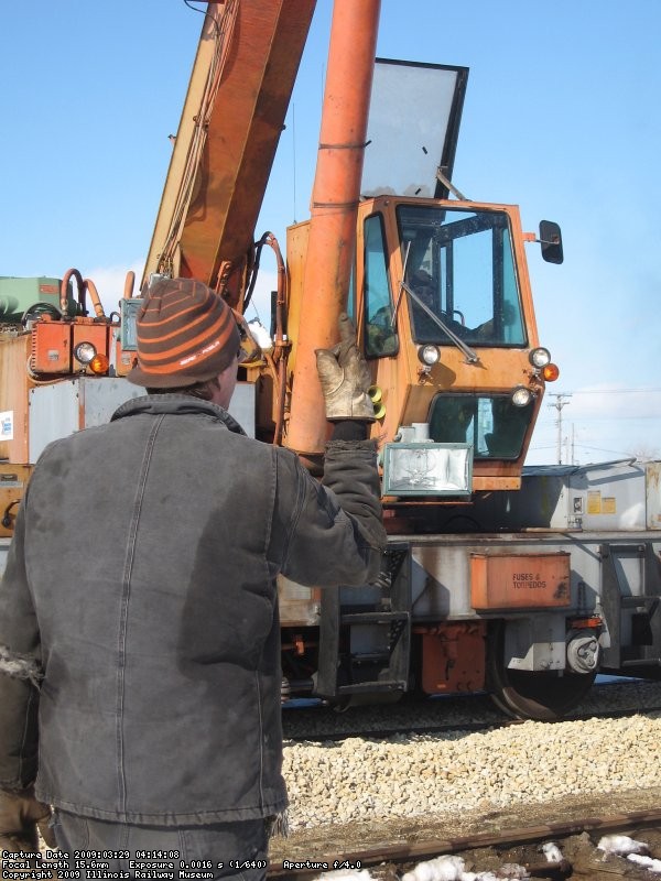 Tom giving the "up" signal to Frank in the cab