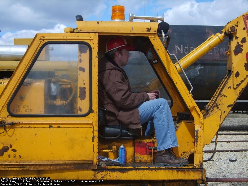 A new volunteer Keith runs the tie crane.