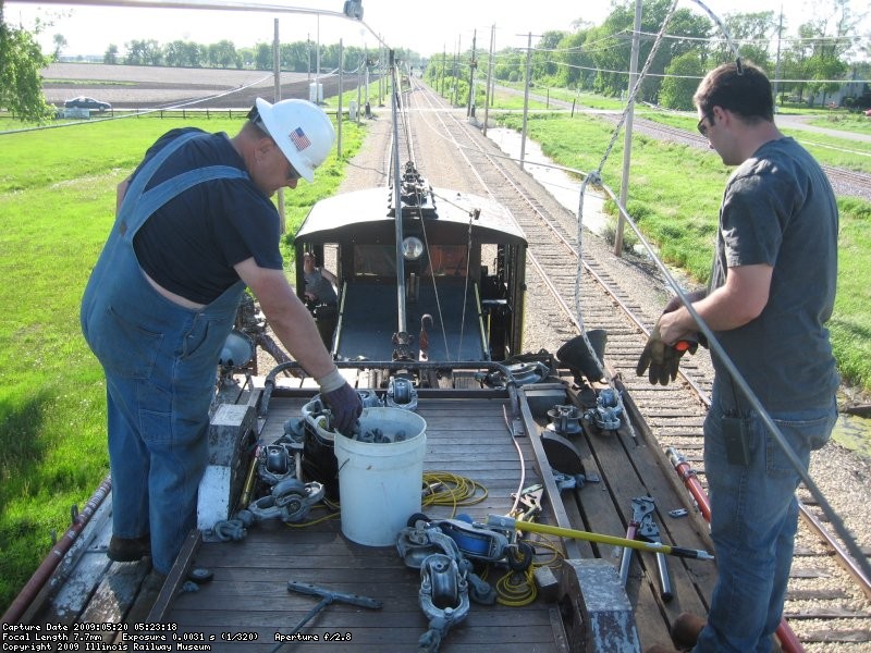 Attaching the new wire to the hangers and removing the guide wheels on top of the CNS&M 604 - btw the wire is Hot