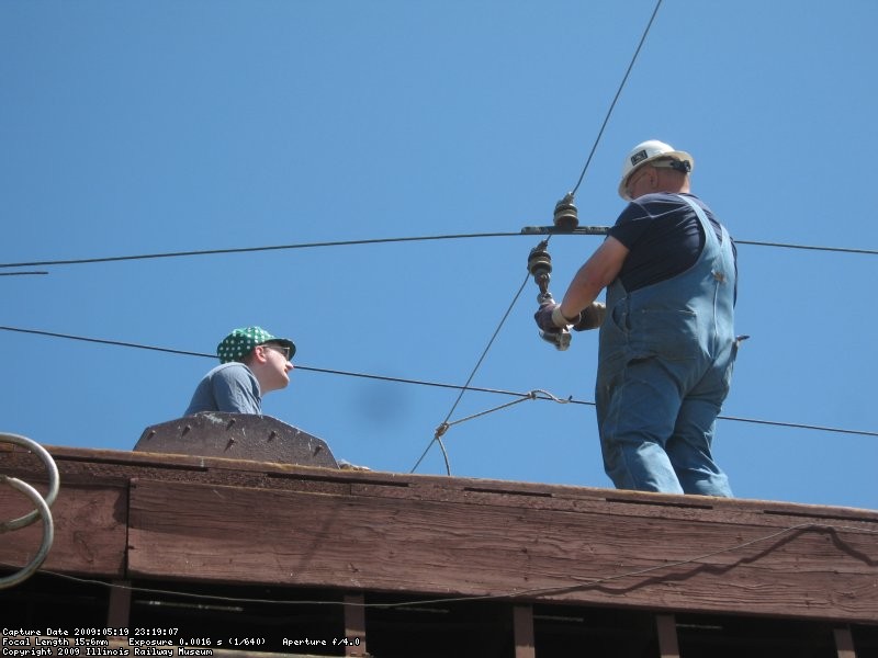 Max and Frank hanging the first roller