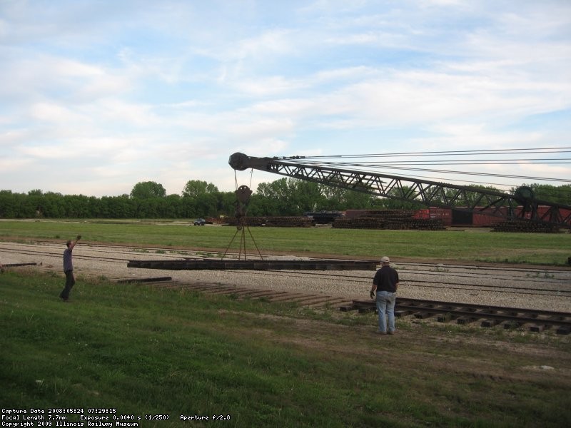 Track panel in the air getting ready to stack on top of the other ones