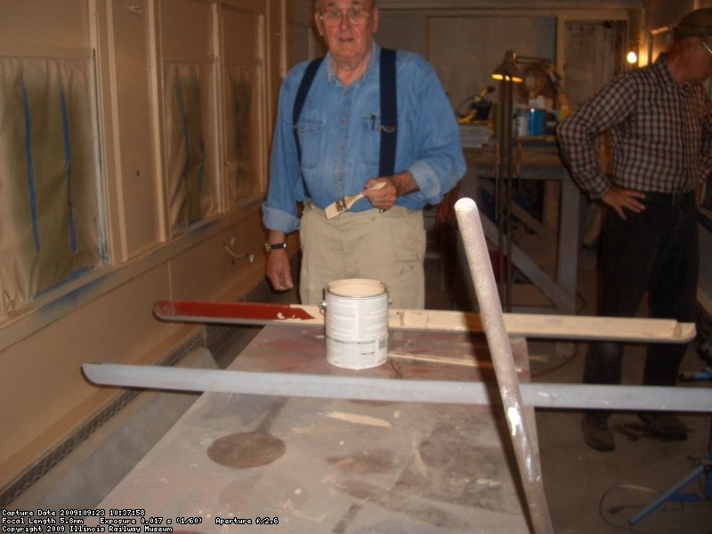 09.23.09 - BOB HUNTER IS PAINTING THE INTERIOR OF THE SHADE COVERS SO THAT THE EXTERIOR CAN BE SPRAYED ON SATURDAY.