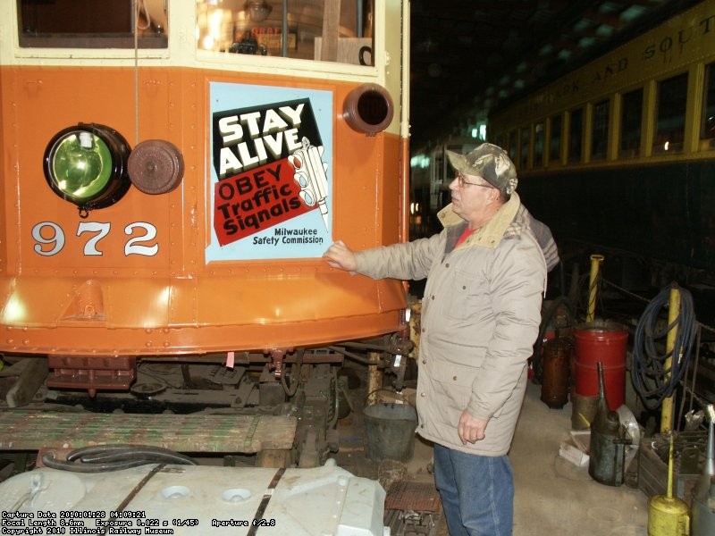 Refinished metal sign being mounted