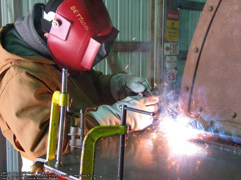 New deck plates are welded in place by Jerry Dettloff