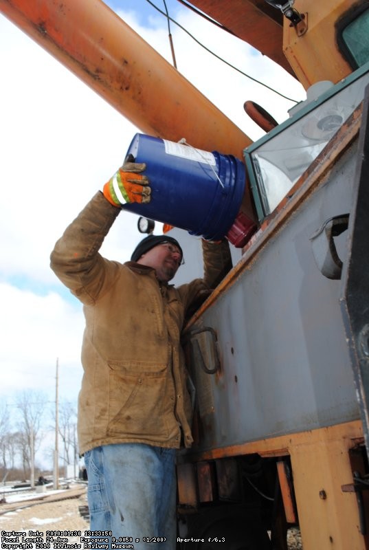 Frank does the honors of topping off the transmission fluid in the Model 50 Burro