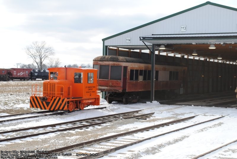 ...and the first storage car heads into the Barn!