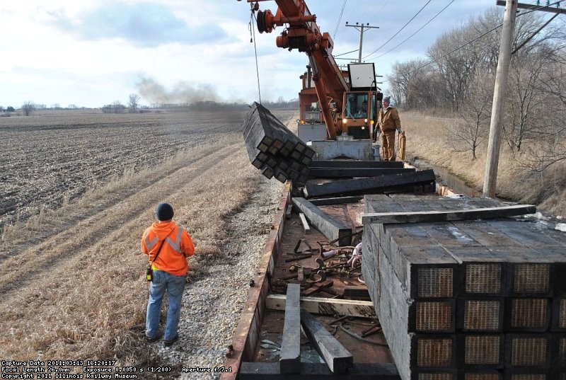 Swinging bundles of new ties along the mainline. 3-13-11