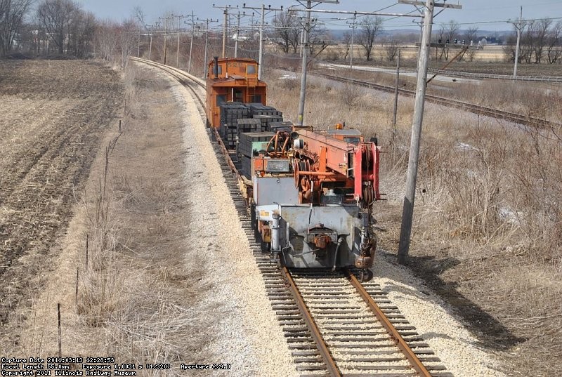 Work train with caboose and new ties heads out to drop off the bundles 3-13-11