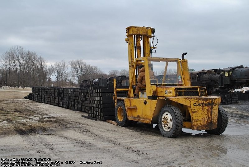 Patrick on the forklift loading new mainline ties onto the flatcar 3-12-11