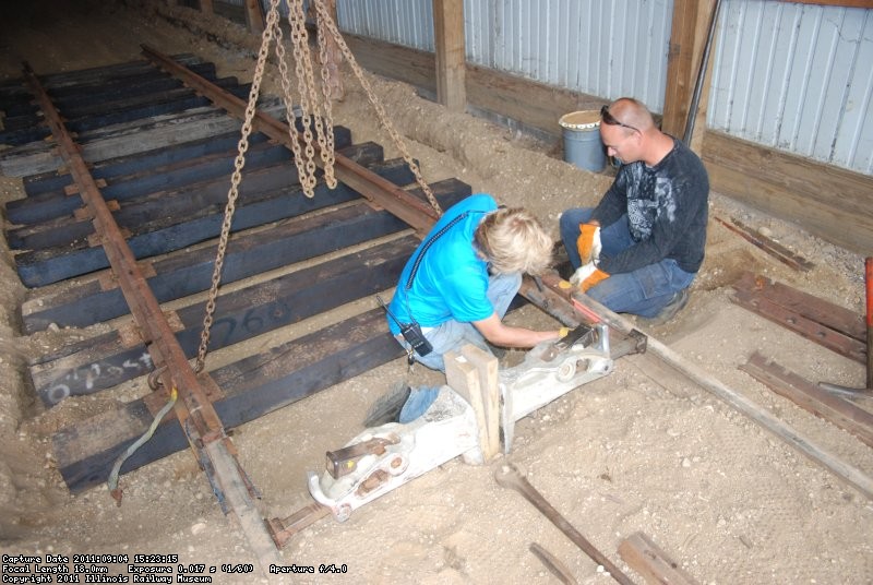 Mark and Tim bolt up the temp comp joint to tie the first new panel of track into track 31. 