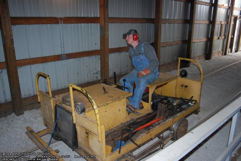 Phil running the compressor into the barn for spot tamping.