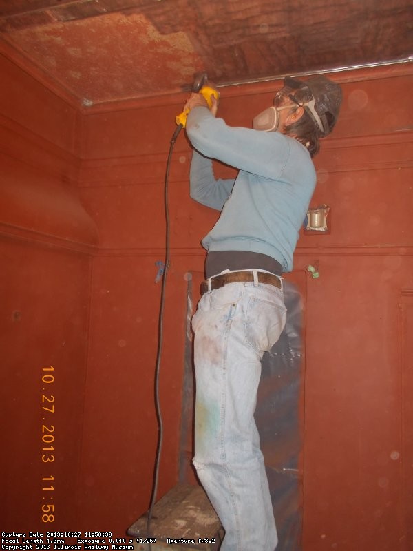Mark using the DeWalt grinder to wirewheel the ceiling of women's washroom  DSCN0645
