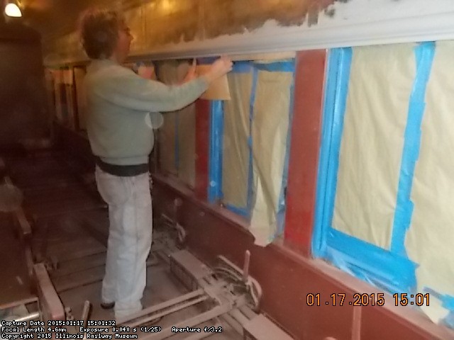 Mark is masking the windows before priming  1-17-15        DSCN1218