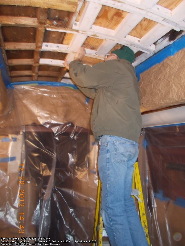 Here's Buzz installing more reinforcement for the ceiling/ roof.  It sure was warmer in Dec,2013            