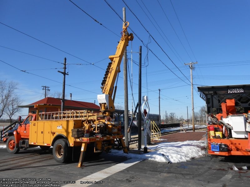 New steel pole installed to replace rotted wood pole.  Extension is needed to provide clearence between trolley bus wires and signal & telephone cables.