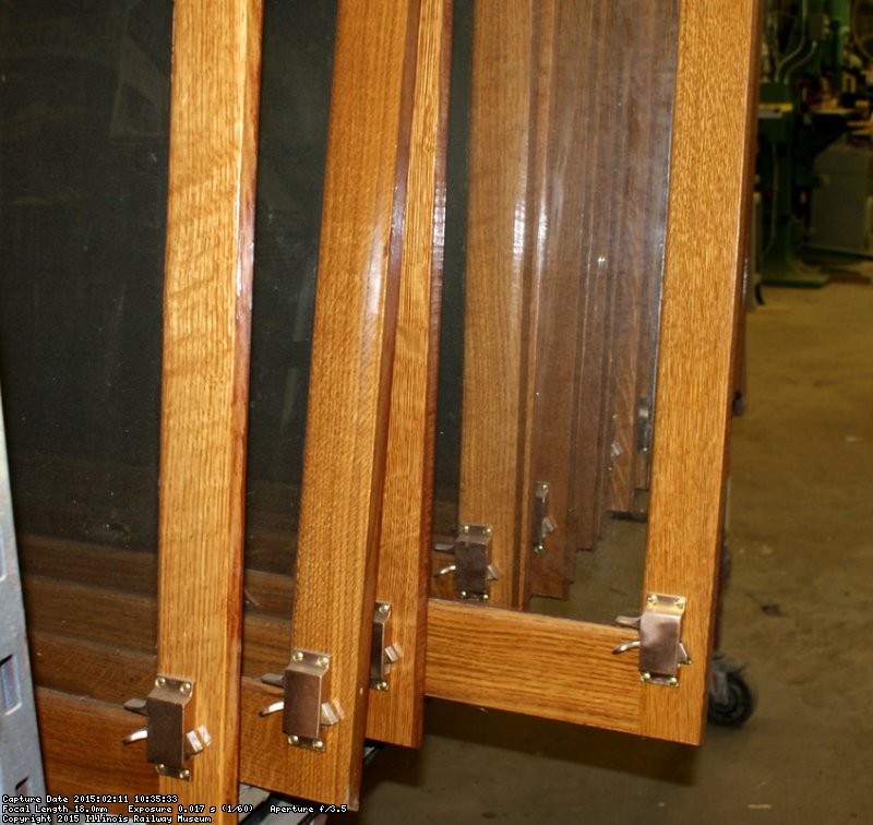 Closer view of a sash with the restored brass hardware - Photo by Buzz Morisette