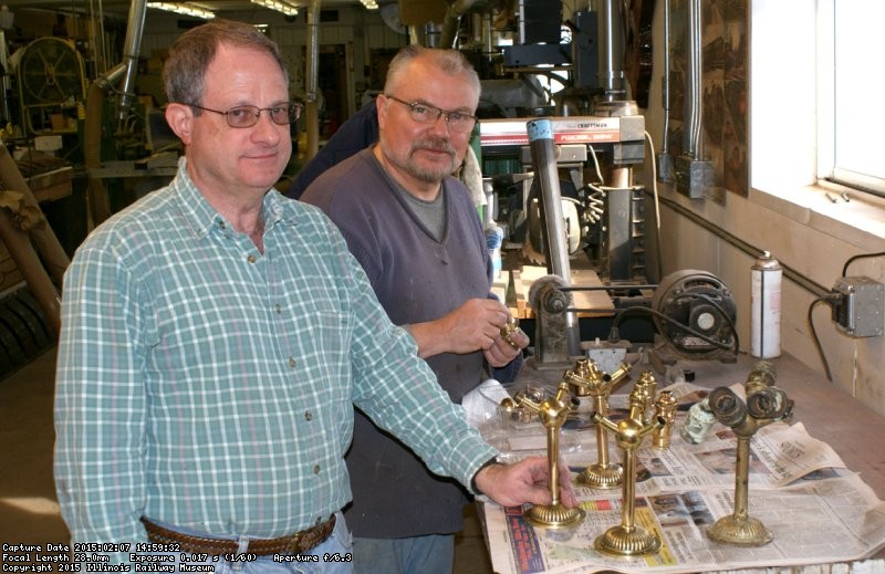 Bill and Keith working on the light fixtures for N.W. El 24 - Photo by Buzz Morisette