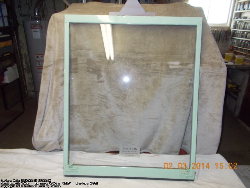 Now ...Here is a similar frame repainted with installed workable window latches, new bottom gasket and "caution" sign applied DSCN0725