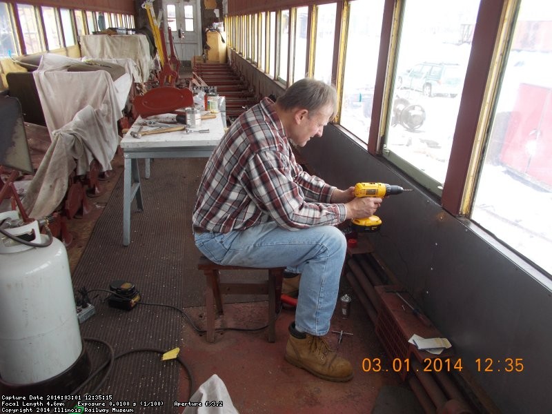     Gary and I have placed the 14 gauge steel into position  Here I am drilling more holes   3-1-14  DSCN0742