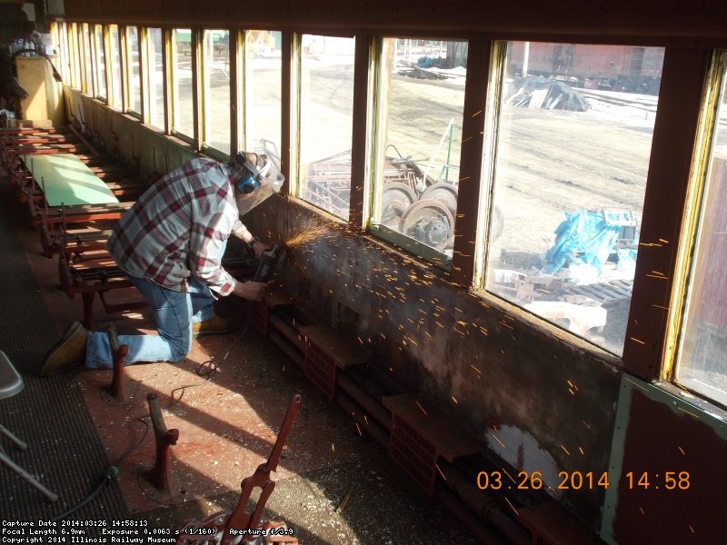   Gary is grinding old bolt heads off last panel on this side.  This is scheduled for replacement in the coming weeks. 3-26-14    fDSCN0771