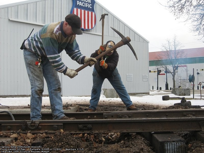 Steve and Frank picking out the frozen ground for the installation of the new timber