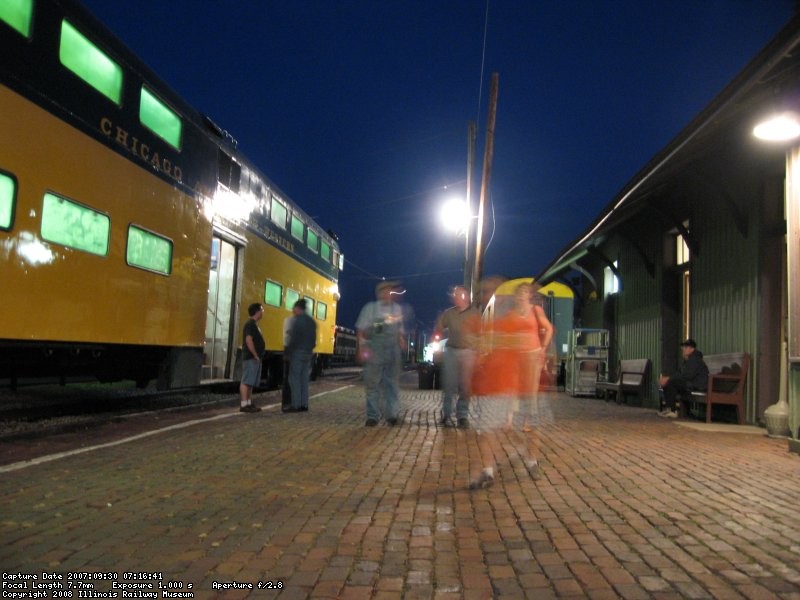 Passengers board the last scoot into the city for the night