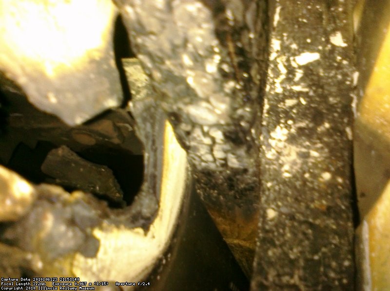 between the outside wall and the back of the DC cabinet, looking down