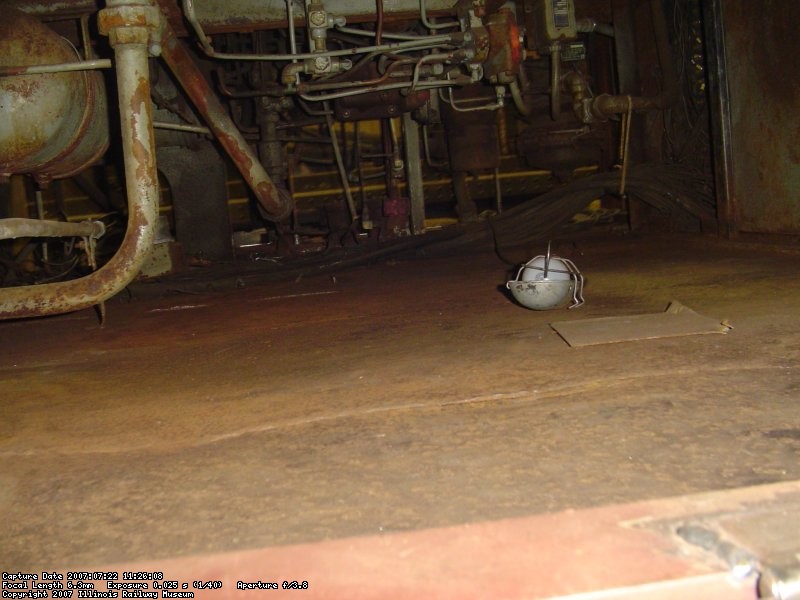 View under the cab where work continues on rotted out electrical trough