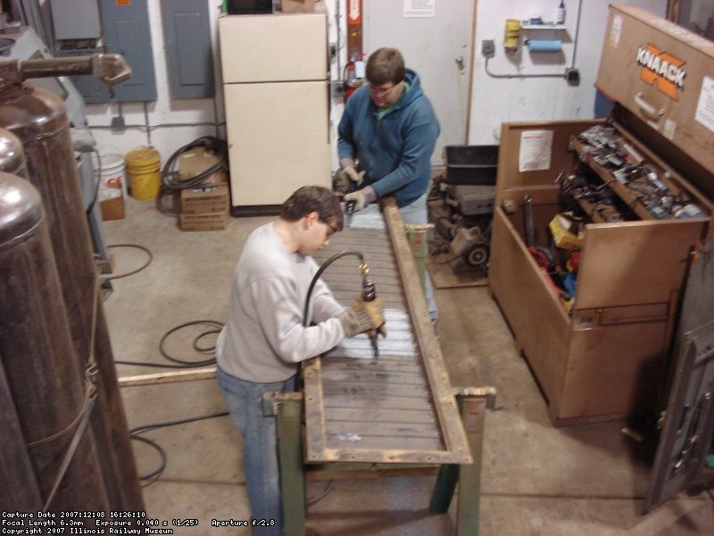 Dan and Brad are needle chipping one of the shutter sets 