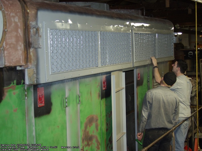 Charlie, Warren and Roger installing the firemans side shutters.