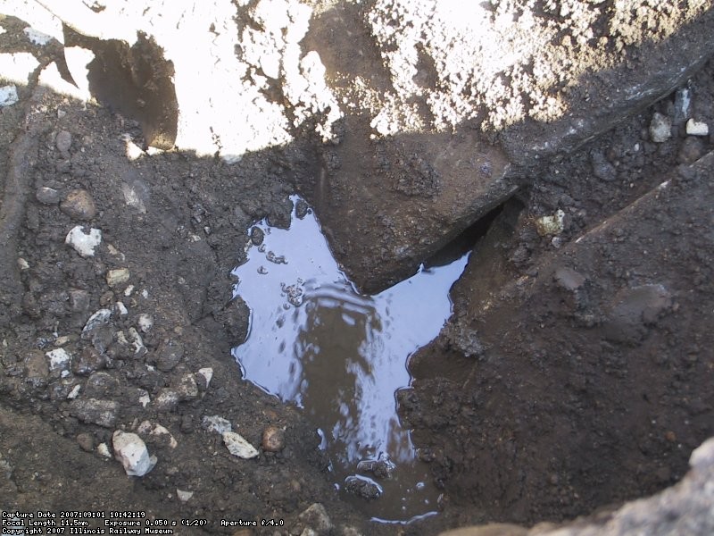 Finally deep enough to see that the two sections of culvert were never properly fitted when installed back in the early 80's.  You can also see where the breach was allowing the earth above to wash away into the culvert.