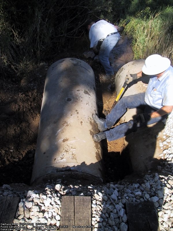 Warren and Jerry doing some filling by hand between the two culverts.